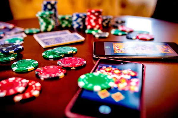 RK888 Live Games — Take part in high-energy casino action A glowing roulette wheel with cascading chips, symbolizing the engaging live and instant-win games available on RK888.